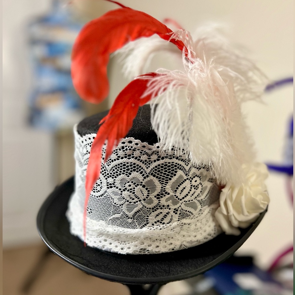 Steampunk cosplay Victorian hat with white lace detail and feather accents